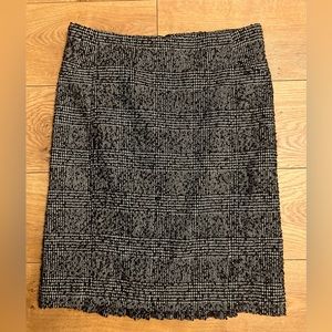 Express tweed black and white skirt with a back kick pleat.